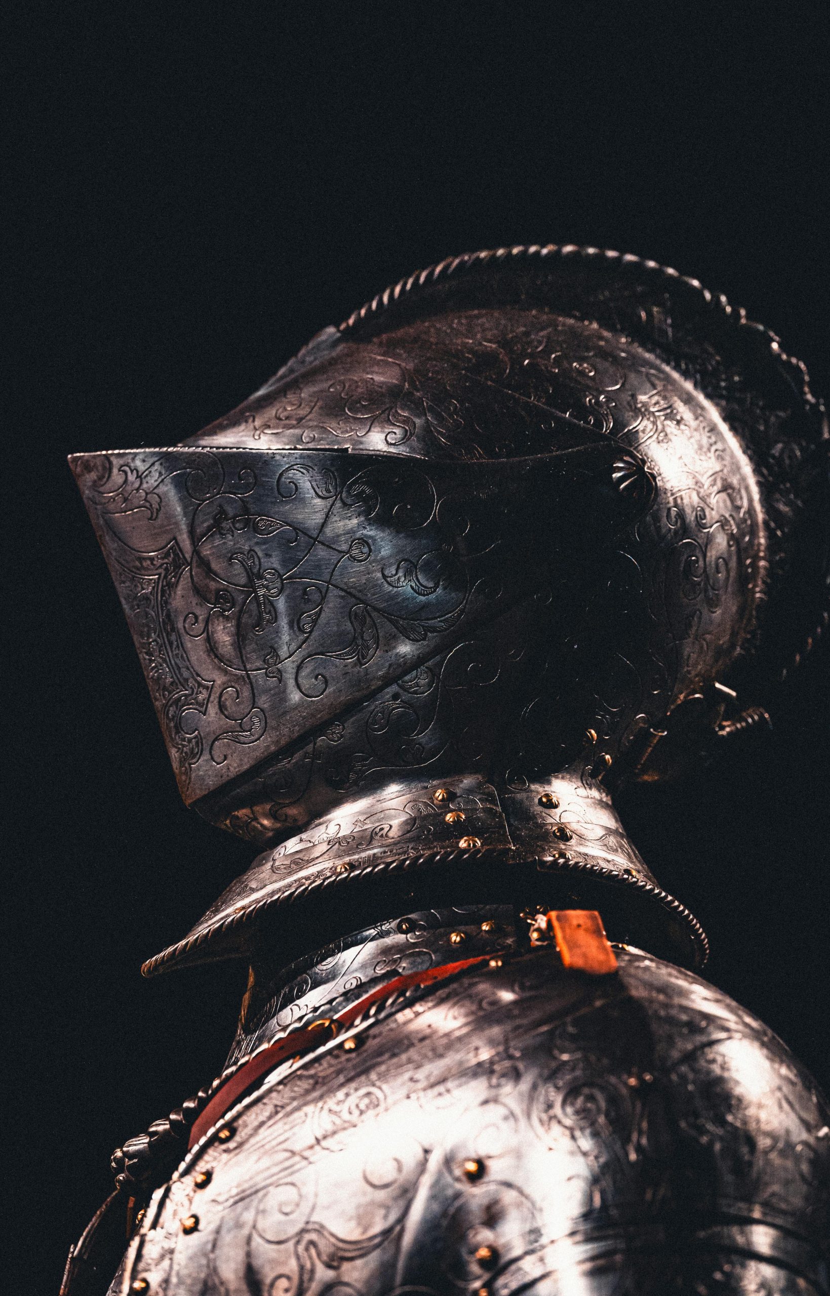 Stock image of a knight's helmet and shoulders.